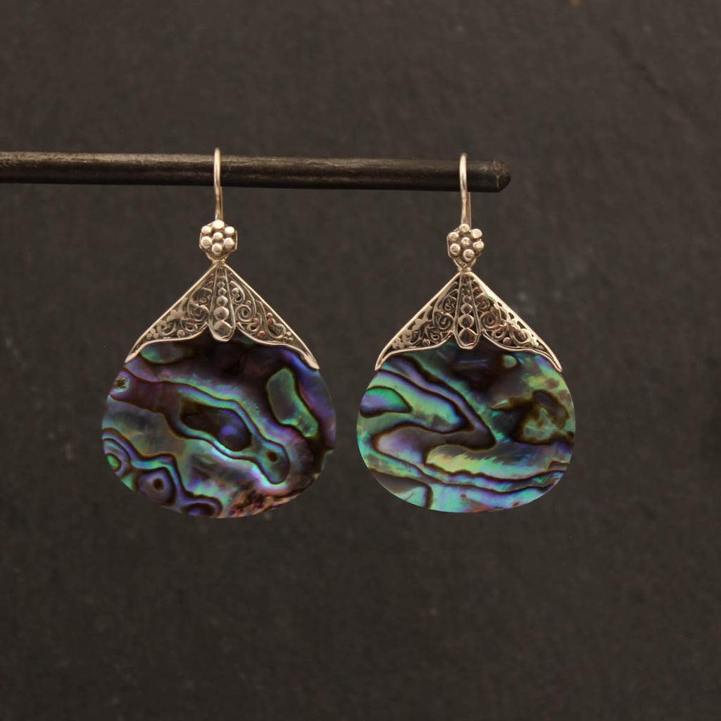 Teardrop shaped abalone drop earrings with intricate sterling silver filigree caps and hooks